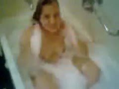 A sultry dilettante with all of her hair chopped off is seen using a soapy restroom.